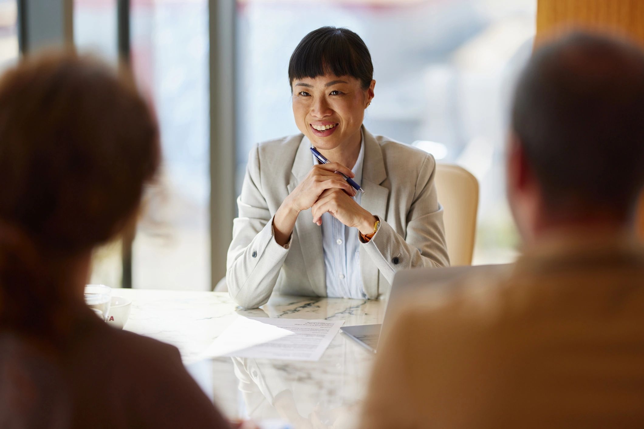 Advisor meeting with clients in a modern office