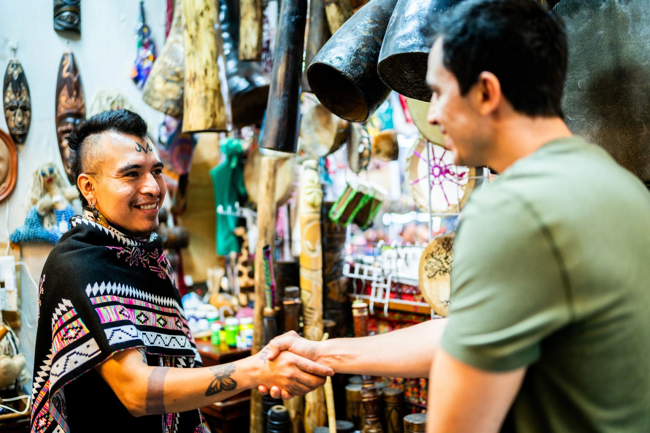 Handshake at a small business storefront
