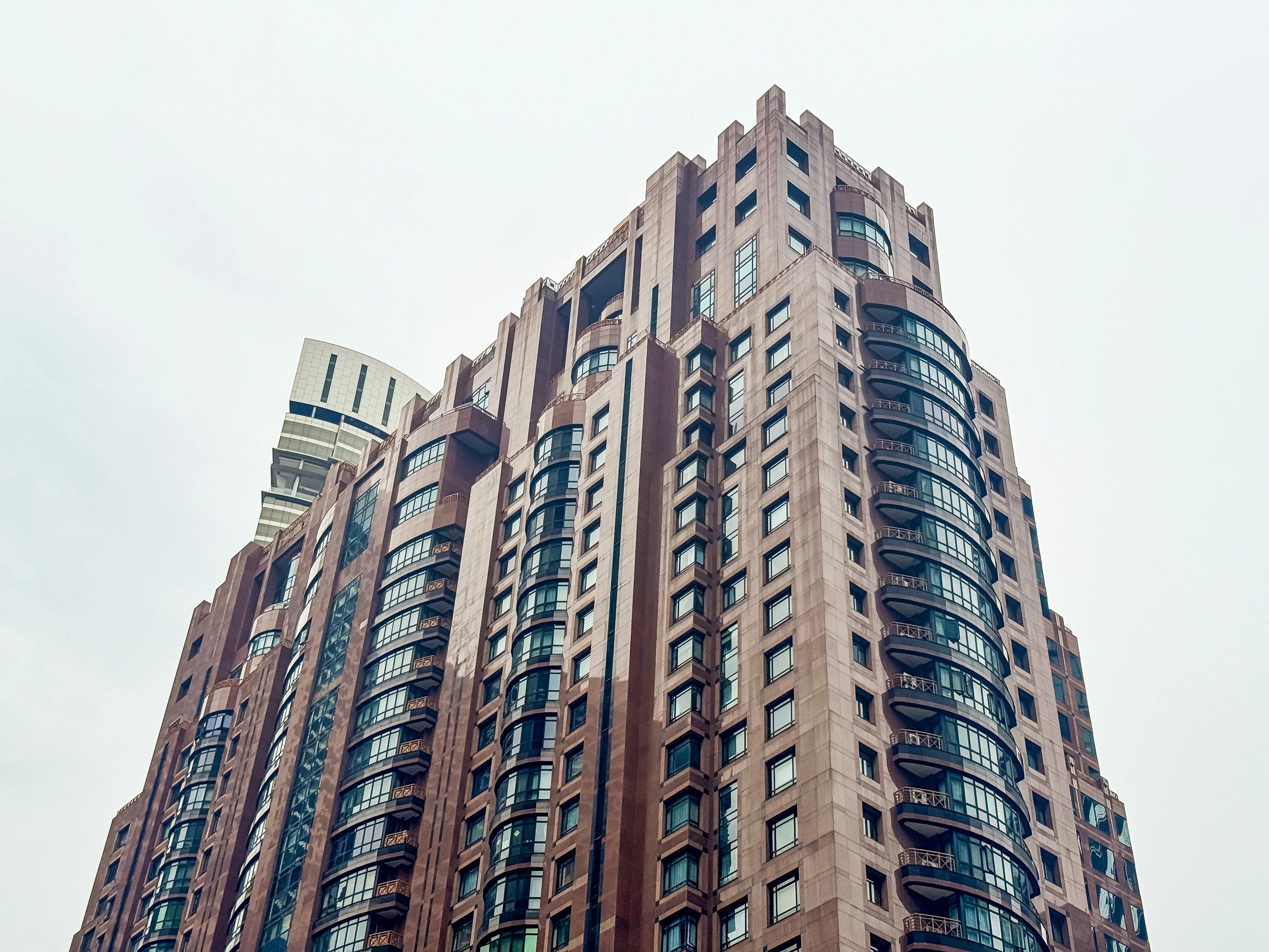 Modern high-rise building representing real estate investing