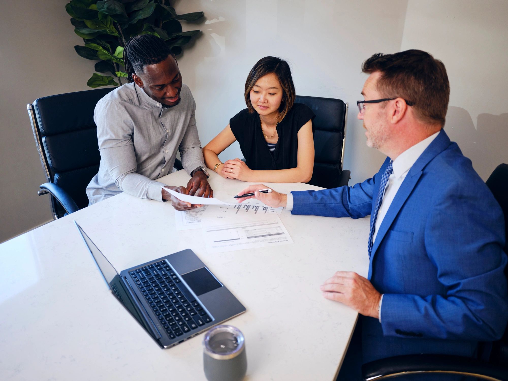 Clients meeting with a financial advisor in an office